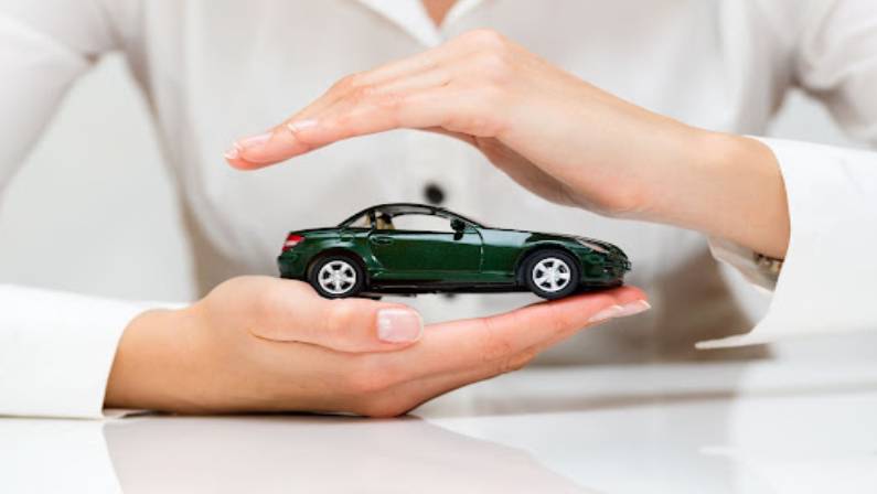 Woman hands and car as protection of car concept